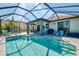 Inviting screened-in pool and backyard, offering a stunning view of the lake and landscaped grounds at 12830 24Th Street E Cir, Parrish, FL 34219