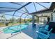 Covered patio overlooking a screened pool and scenic waterfront, perfect for outdoor entertainment at 12830 24Th Street E Cir, Parrish, FL 34219