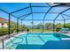 Clear view of the pool and lake in a screened-in enclosure, offering a serene backyard retreat at 12830 24Th Street E Cir, Parrish, FL 34219