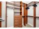 Walk-in closet with built-in shelving and drawers, offering ample storage space at 141 Bella Vista Ter # 34D, Nokomis, FL 34275