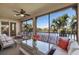 Screened lanai with comfortable seating and water views, perfect for relaxation at 141 Bella Vista Ter # 34D, Nokomis, FL 34275