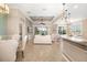 Spacious living room featuring tile floors, recessed ceiling, and sliding glass doors to outdoor views at 141 Bella Vista Ter # 34D, Nokomis, FL 34275