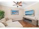 Cozy living room featuring a comfortable sectional and an entertainment center at 141 Bella Vista Ter # 34D, Nokomis, FL 34275