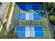 Aerial view of outdoor pickleball courts, perfect for players of all skill levels at 141 Bella Vista Ter # 34D, Nokomis, FL 34275