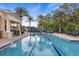 Outdoor swimming pool featuring lap lanes and ample seating, ideal for relaxation and exercise at 141 Bella Vista Ter # 34D, Nokomis, FL 34275