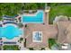 Top-down shot of a large swimming pool and lounge area, perfect for relaxing at 141 Bella Vista Ter # 34D, Nokomis, FL 34275