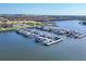 Aerial view of a marina featuring multiple boats docked near a residential community at 1613 4Th E St, Palmetto, FL 34221