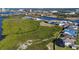 Gorgeous aerial view showcasing homes nestled near a waterway and lush green spaces at 1613 4Th E St, Palmetto, FL 34221