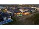 Aerial view of a luxury home with a screened pool in a waterfront community at 1613 4Th E St, Palmetto, FL 34221