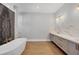Contemporary bathroom featuring a freestanding tub, marble accents, and modern fixtures at 1613 4Th E St, Palmetto, FL 34221