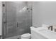Modern bathroom featuring a glass shower, white vanity, and chrome fixtures at 1613 4Th E St, Palmetto, FL 34221