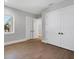 Spacious bedroom with wood-look floors, natural light, and ample closet space at 1613 4Th E St, Palmetto, FL 34221