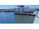 Dock and boat lift with a motor yacht ready for a day on the water at 1613 4Th E St, Palmetto, FL 34221