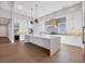 A gourmet kitchen with a large center island, custom cabinetry, and modern stainless steel appliances at 1613 4Th E St, Palmetto, FL 34221