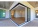 Covered patio entry to open living area featuring tile floors and abundant natural light at 1613 4Th E St, Palmetto, FL 34221
