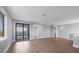 Open living area featuring light wood floors, recessed lighting, and an access to a balcony at 1613 4Th E St, Palmetto, FL 34221