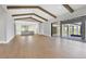 Open-concept home design seamlessly connects the living room, kitchen, and outdoor patio at 1613 4Th E St, Palmetto, FL 34221