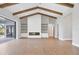 Bright living room with vaulted ceiling, exposed beams, fireplace, and sliding doors to the outdoor area at 1613 4Th E St, Palmetto, FL 34221