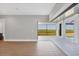 Bright room with hardwood-style floors leading to outdoor patio area with scenic views at 1613 4Th E St, Palmetto, FL 34221
