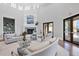 Elegant clubhouse lounge with cozy sofas, fireplace, hardwood floors, and access to outdoor amenities at 1613 4Th E St, Palmetto, FL 34221