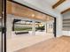An outdoor living area with a hot tub and pool offers a serene view of the open water at 1613 4Th E St, Palmetto, FL 34221