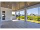 Spacious screened-in patio with a view of lush greenery, offering a tranquil outdoor space at 1613 4Th E St, Palmetto, FL 34221