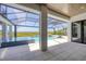 Covered patio with pool and landscape views, perfect for outdoor relaxation and entertaining at 1613 4Th E St, Palmetto, FL 34221