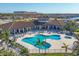 Aerial view of a community pool, featuring ample seating and lush landscaping at 1613 4Th E St, Palmetto, FL 34221