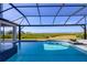 Relax in this screened pool equipped with bar seating, water features, and lovely views at 1613 4Th E St, Palmetto, FL 34221
