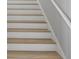 Clean, modern staircase with light wood treads and white risers at 1613 4Th E St, Palmetto, FL 34221