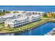 Aerial view of coastal property with private docks, lush green spaces, and serene blue waters at 1617 Sea Haven Dr # 501, Punta Gorda, FL 33950