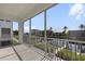 Balcony featuring serene canal views and manicured landscaping, creating a peaceful outdoor retreat at 1617 Sea Haven Dr # 501, Punta Gorda, FL 33950