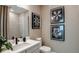 Cozy bathroom with neutral tones, a single vanity, and decorative wall art at 1617 Sea Haven Dr # 501, Punta Gorda, FL 33950