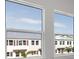 Bedroom showcasing bright windows offering community views and letting in natural light at 1617 Sea Haven Dr # 501, Punta Gorda, FL 33950