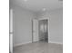 Bright bedroom featuring neutral walls, an open door and wood look tile floors at 1617 Sea Haven Dr # 501, Punta Gorda, FL 33950