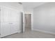 Bedroom with neutral paint, wood look tile floors and closet space at 1617 Sea Haven Dr # 501, Punta Gorda, FL 33950