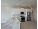 Well-lit kitchen featuring a center island, stainless steel appliances, and plenty of cabinet space at 1617 Sea Haven Dr # 501, Punta Gorda, FL 33950