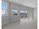 Spacious living room featuring modern tile flooring and large windows at 1617 Sea Haven Dr # 501, Punta Gorda, FL 33950