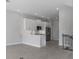 Cozy living room connected to kitchen with stairwell and windows at 1617 Sea Haven Dr # 501, Punta Gorda, FL 33950