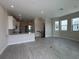 Open-concept living area featuring wood-look floors, natural light, and a seamless transition to the kitchen at 1617 Sea Haven Dr # 501, Punta Gorda, FL 33950