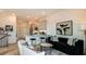 A modern living room open to the kitchen with stylish furniture and decor at 1617 Sea Haven Dr # 501, Punta Gorda, FL 33950