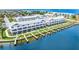 Stunning aerial view of waterfront townhomes with private boat docks and meticulously landscaped grounds at 1617 Sea Haven Dr # 502, Punta Gorda, FL 33950