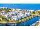 Aerial view displays waterfront townhomes, private boat docks, neighborhood amenities, and waterway access at 1617 Sea Haven Dr # 502, Punta Gorda, FL 33950