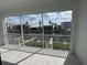 Covered balcony featuring waterfront views, a railing, and tile flooring at 1617 Sea Haven Dr # 502, Punta Gorda, FL 33950