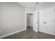 Bedroom with sleek hardwood floors, neutral paint, and double doors at 1617 Sea Haven Dr # 502, Punta Gorda, FL 33950