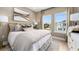 Bedroom features a queen-sized bed, dresser, and view from the window at 1617 Sea Haven Dr # 502, Punta Gorda, FL 33950