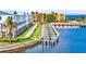 Waterfront townhome exterior highlighting boat docks, lush landscaping, and architectural design at 1617 Sea Haven Dr # 502, Punta Gorda, FL 33950