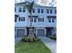 Close-up exterior showcasing charming townhouses, well-maintained landscaping, and paved driveways at 1617 Sea Haven Dr # 502, Punta Gorda, FL 33950