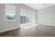 Neutral living room with hardwood floors and sliding glass doors that let in lots of natural light and waterfront views at 1617 Sea Haven Dr # 502, Punta Gorda, FL 33950