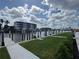 Picturesque waterfront view showcasing docks, lush landscaping, and residential buildings on a sunny day at 1617 Sea Haven Dr # 502, Punta Gorda, FL 33950